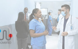 Two clinicians having a conversation in a hospital