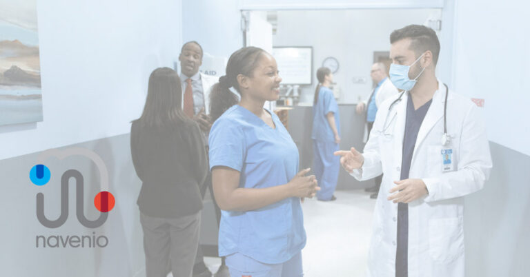 Two clinicians having a conversation in a hospital